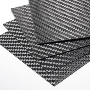 4 pack of thin carbon fiber sheets with gloss finishes - stacked in the order (from bottom to top) of .25mm, .5mm, 1.0mm, and 1.3mm